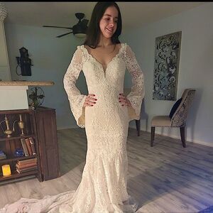Lace Boho Mermaid Wedding Dress with Bell Sleeves and Plunging Neckline